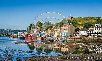 Tarbert pier with fisherman`s boats and ferry. Stock Photo