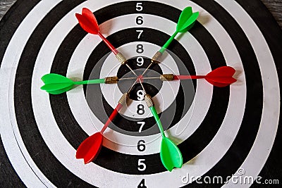 Target darts board with bull eyes, Reach to business goal with the power of the team Stock Photo