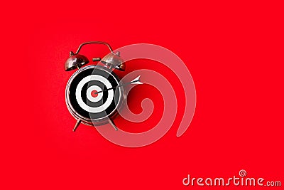 Target time, goal sign on clock face over red background with copy space Stock Photo