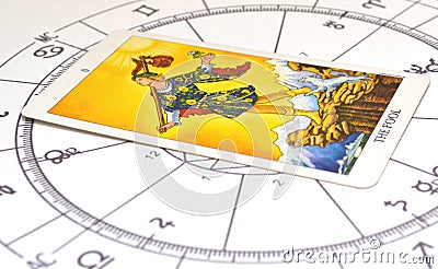 Tarot and astrology. The Fool card on a astro chart. Stock Photo