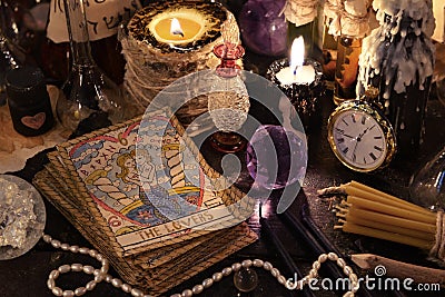 The tarot cards with crystal, candles and magic objects Stock Photo