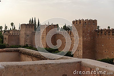 Taroudant old medieval defensive wall and palms alley, Morocco Stock Photo