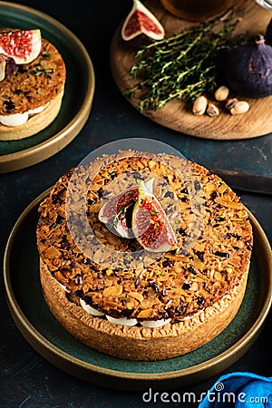 Tarte on sand base with fresh figs, almonds and crispy waffle wi Stock Photo