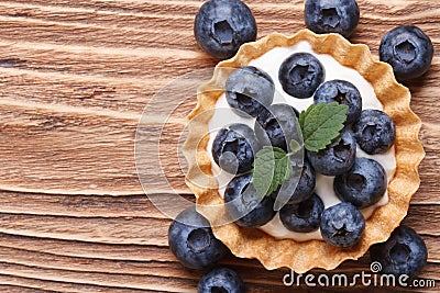 Tartlet with fresh blueberries on a wooden horizontal top view Stock Photo