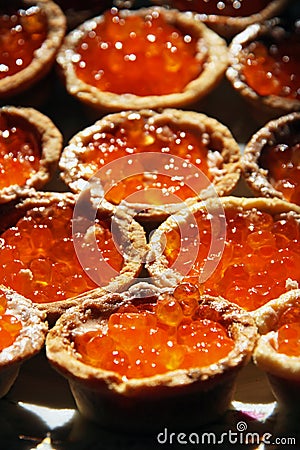 Tartlet with red salmon caviar Stock Photo