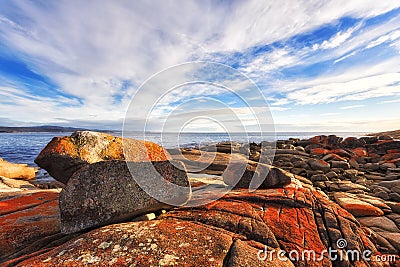 Tas Bay fire flat rocks red Stock Photo