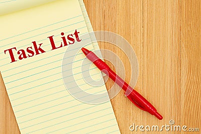 Task List message on a notepad and pen on wood desk Stock Photo