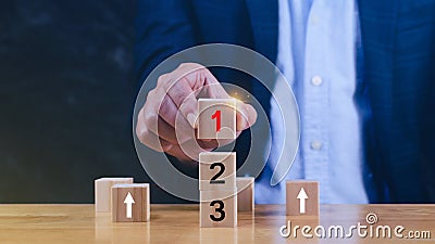 Task priority and management concept, The order of priority in any activity, Set work priority, arrange to do list. Hand arranging Stock Photo