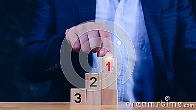 Task priority and management concept, The order of priority in any activity, Set work priority, arrange to do list. Hand arranging Stock Photo