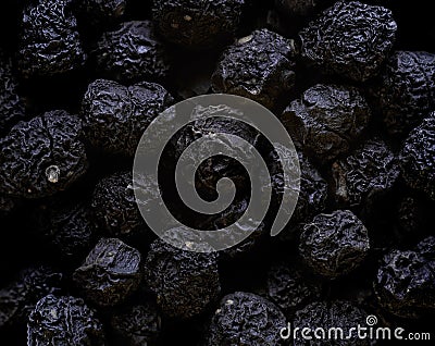 Tasmanian lanceolata large black pepper berry polka dots peas from australia very close in detail Stock Photo