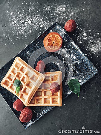 Tasteful vaffles and dried strawberries for breakfast Stock Photo