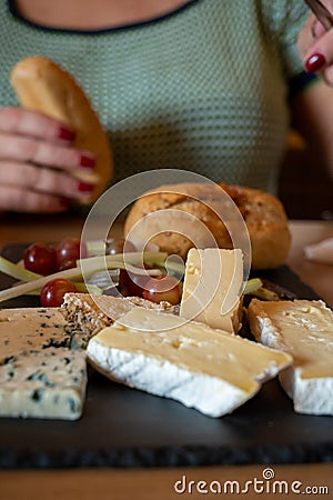 Tasting of farmers scottish cheeses cheddar, stilton, blue cheese, brie in Edinburgh, UK Stock Photo