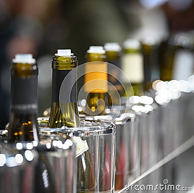 Tasting wine, Row of vintage wine bottles in a wine cellar Stock Photo