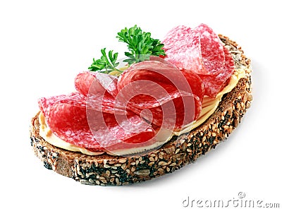 Tasty appetizer of salami on wholewheat bread Stock Photo