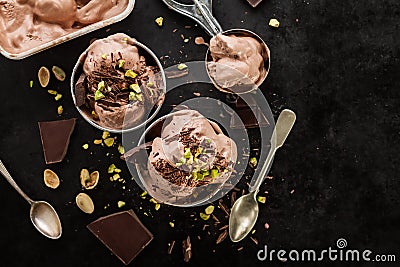 Tasty appetizing chocolate ice cream with mint and pistachios in Stock Photo