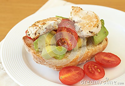 Tasty avocado, tomato and chicken bruschetta Stock Photo