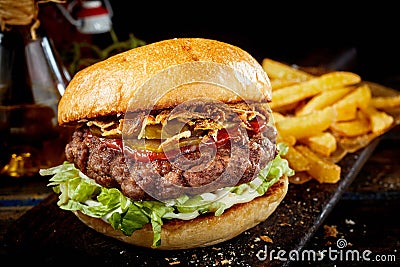 Tasty beef burger with ketchup and ham Stock Photo