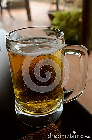 Tasty beer in a big mug Stock Photo