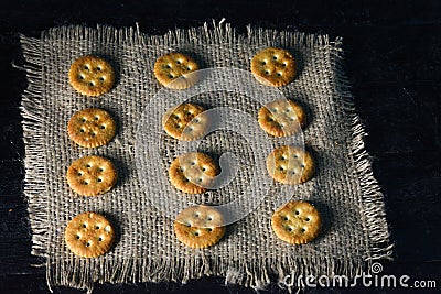 Tasty biscuits on a wooden background and jute. Stock Photo