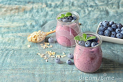 Tasty blueberry smoothie in jars, berries Stock Photo