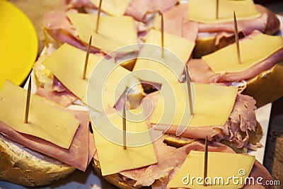 Tasty canapes with cheese, ham and butter Stock Photo