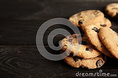 Tasty chocolate chip cookies on wooden table. Stock Photo