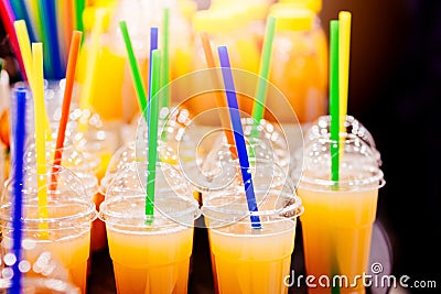 Tasty cold orange juice in plastic cup Stock Photo