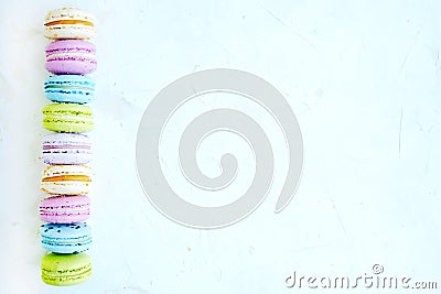 Tasty colorful macaroons in marble background. Text space. Pastel colors. Stock Photo