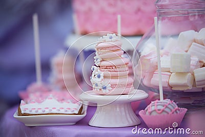 Tasty confectionery on the table. Macaroons. Marshmallows. Cupcakes. Cacke. Stock Photo