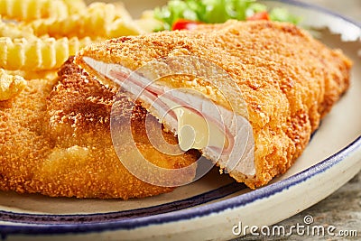 Tasty cordon bleu with cheese on plate Stock Photo