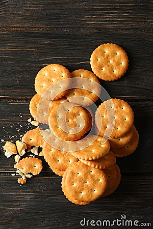 Tasty cracker biscuits on wooden background, top view Stock Photo