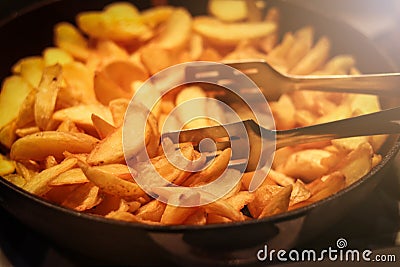 Tasty crispy fried wedges of potato served Stock Photo