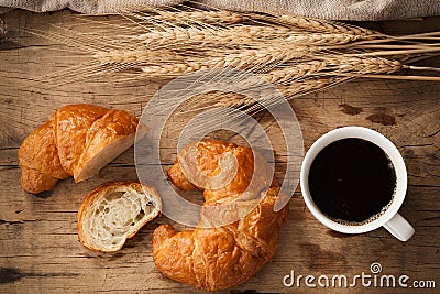 Tasty croissant and coffee still life rustic Stock Photo