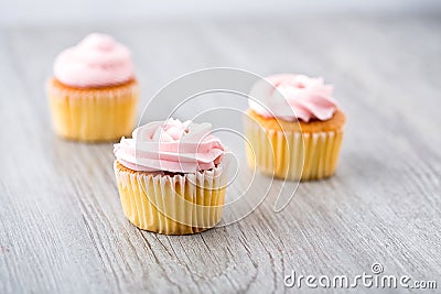 Tasty cupcake on wooden background. Birthday cupcakes on gray wooden background. Space for Text. Selective focus Stock Photo