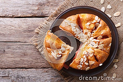 Tasty cutting almond pear pie closeup top view of the horizontal Stock Photo