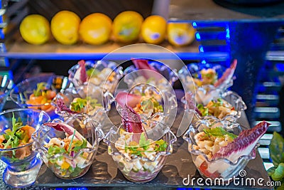 Tasty delicious appetizers in the small glasses in the buffet Stock Photo