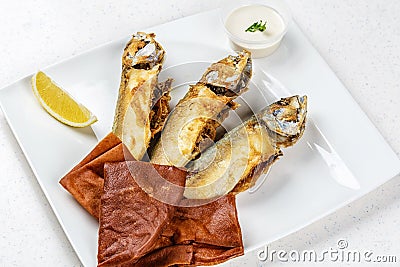 Tasty fish with vegetables and lemon Stock Photo