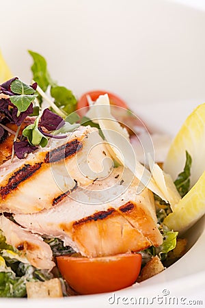 Tasty fresh caesar salad with grilled chicken and parmesan Stock Photo