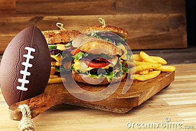 Tasty fresh meat burgers with salad and cheese. Homemade angus burger. Great for Bowl football Game angus burger Stock Photo