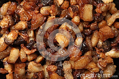 Tasty fried cracklings as background, top view. Cooked pork lard Stock Photo