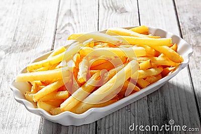 Tasty Fried Potato French Fries on White Plate Stock Photo