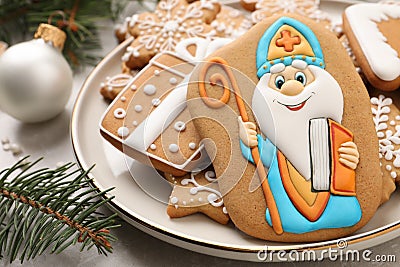 Tasty gingerbread cookies and festive decor on table, closeup. St. Nicholas Day celebration Stock Photo