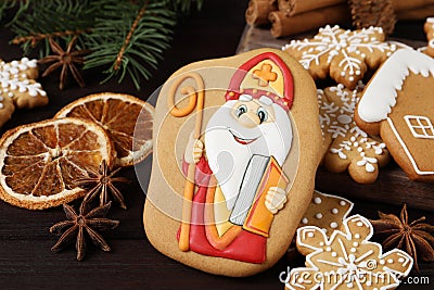 Tasty gingerbread cookies on wooden table, closeup. St. Nicholas Day celebration Stock Photo