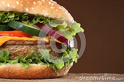 Tasty hamburger on wood background Stock Photo