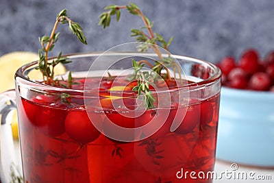 Tasty and healthy cranberry juice cranberry mors with thyme and lemon, a good drink to strengthen the immune system Stock Photo