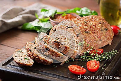 Tasty homemade ground baked turkey meatloaf on wooden table. Stock Photo