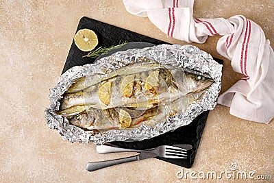 Tasty homemade roasted zander and perch served on table, top view. Stock Photo