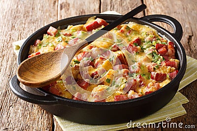 Tasty hot homemade strata with ham, onions, cheese and eggs close-up on the table. horizontal Stock Photo