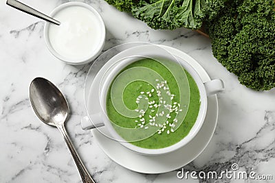 Tasty kale soup served on white marble table, flat lay Stock Photo