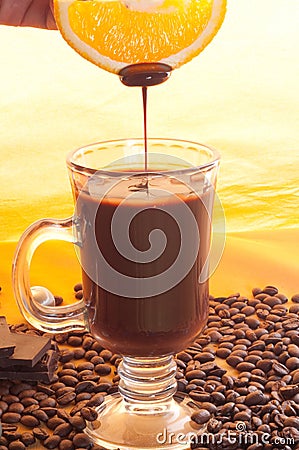 Tasty liquid chocolate on glass Stock Photo